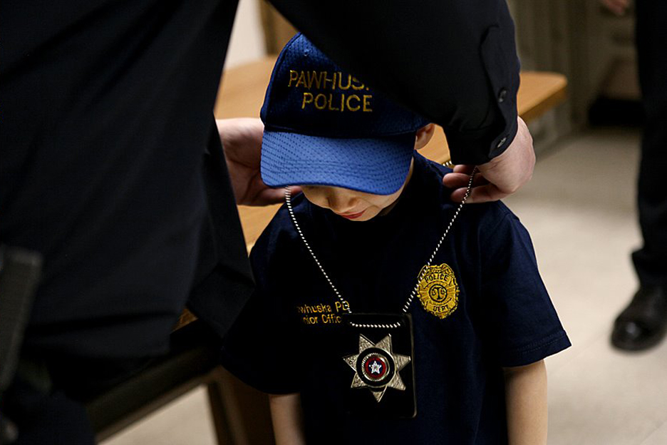 Lil D getting his Pawhuska police officer badge. A real one.
