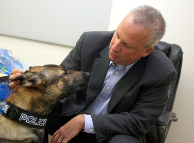 Poulsbo Police Chief Al Townsend with the department’s new drug dog Monday. The city has not settled on a name for the dog. (Larry Steagall / Kitsap Sun)